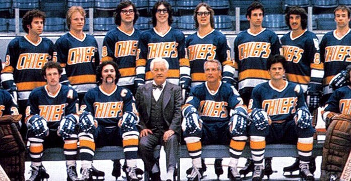 Screenshot of the movie 'Slap Shot.' Team photo of the Charleston Chiefs.