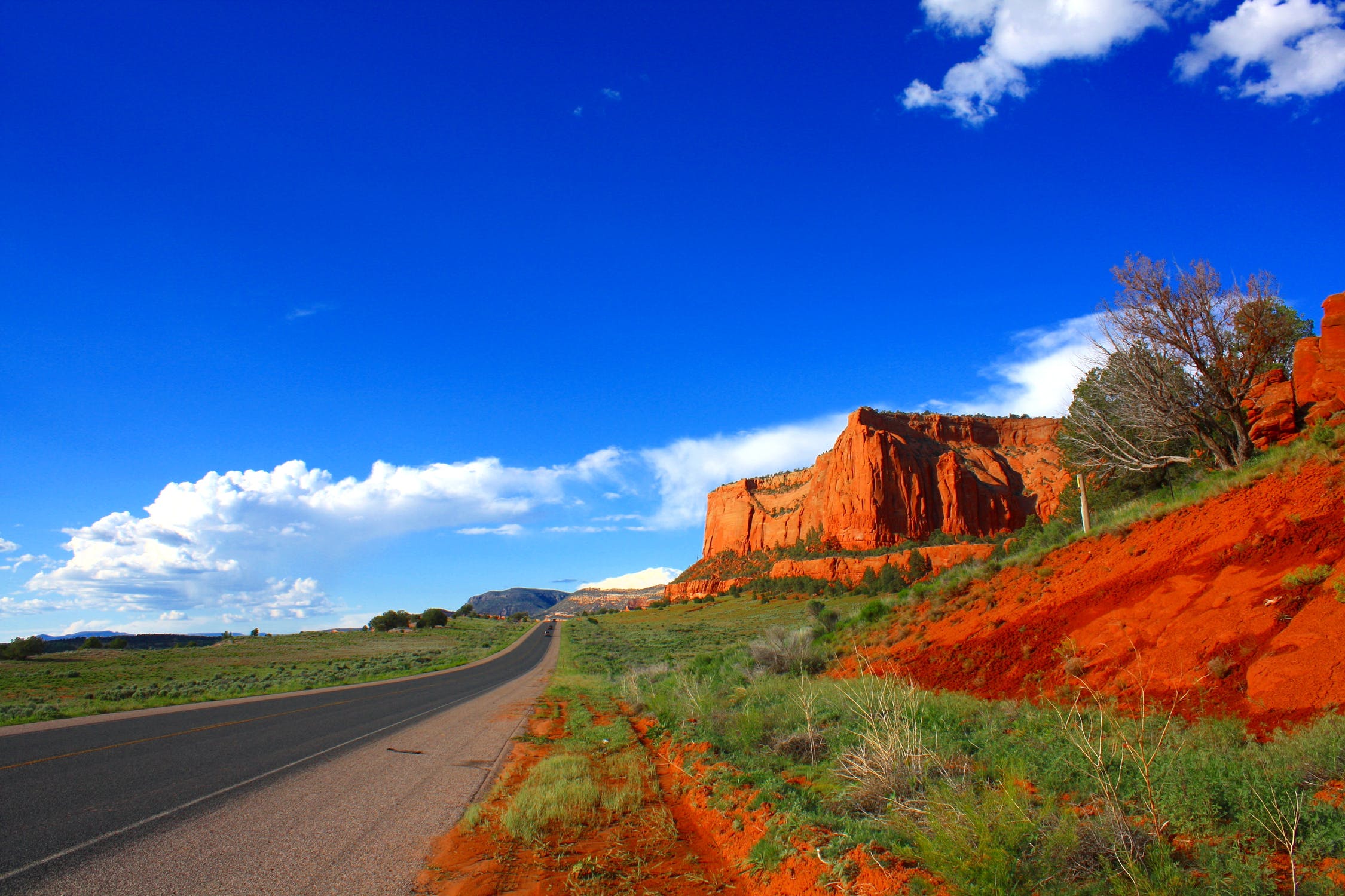 Random Loanly Road - Arizona. Sprawling flat lands dotted with picturesique mountains.