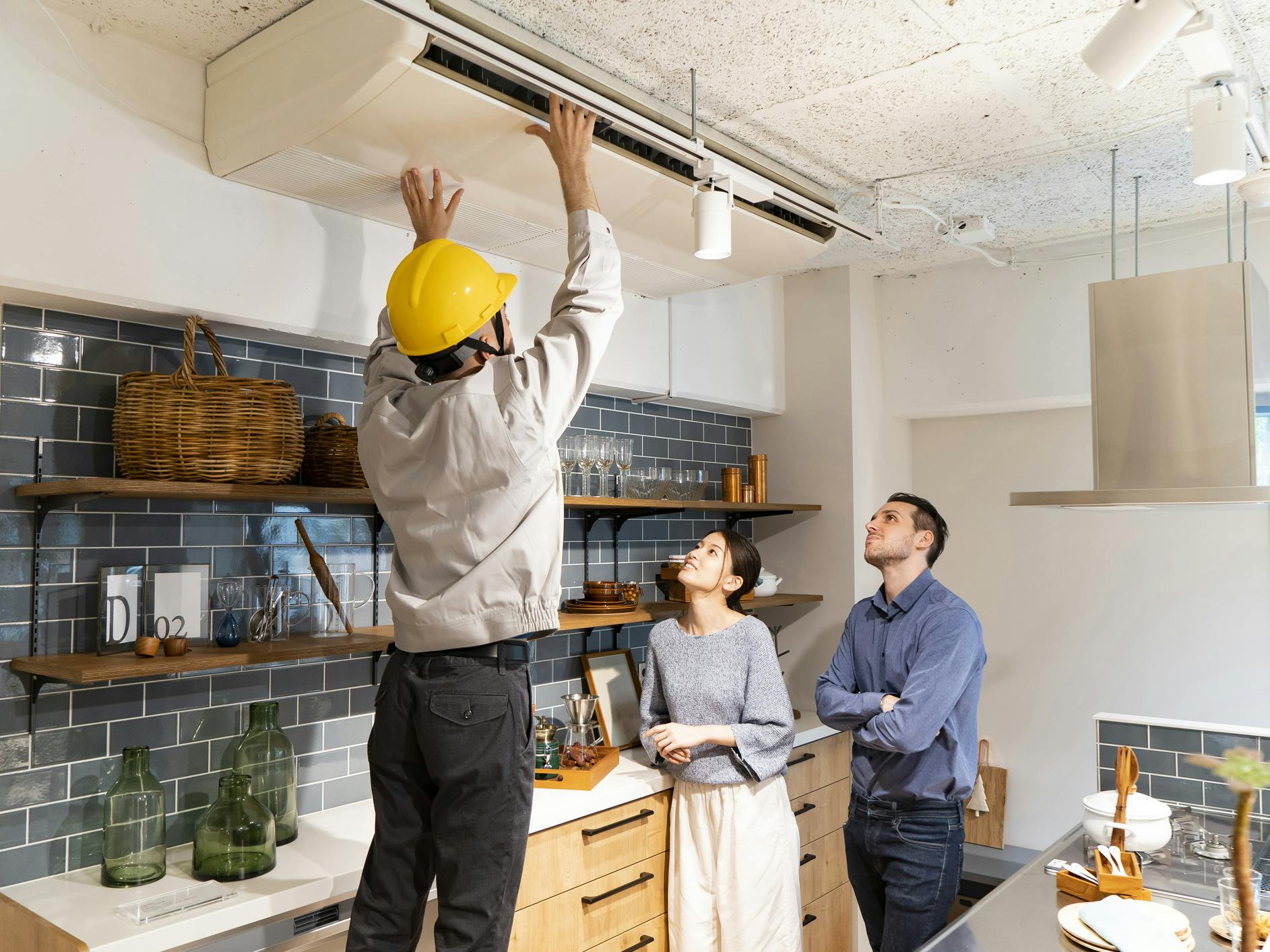A repairman checking the air conditioner