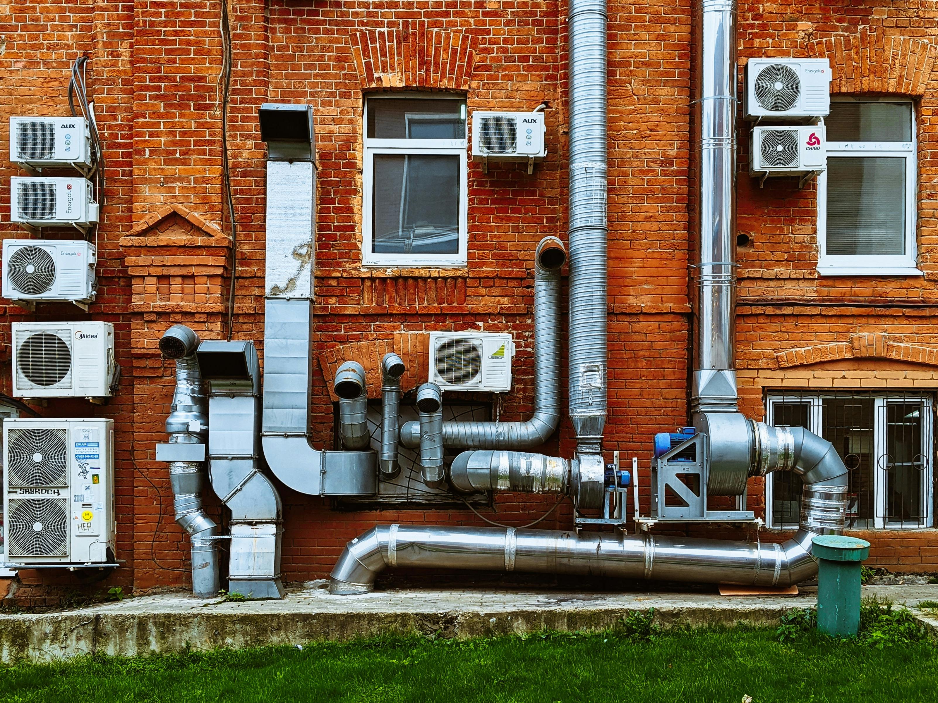 a building with a bunch of pipes on the side of it