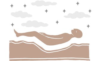person lying on mattress with body impressions
