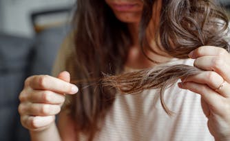 person examining hair