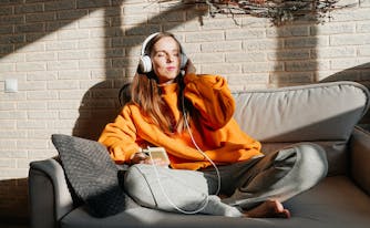 person listening to asmr in headphones