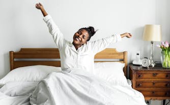 person practicing good sleep hygiene in bed
