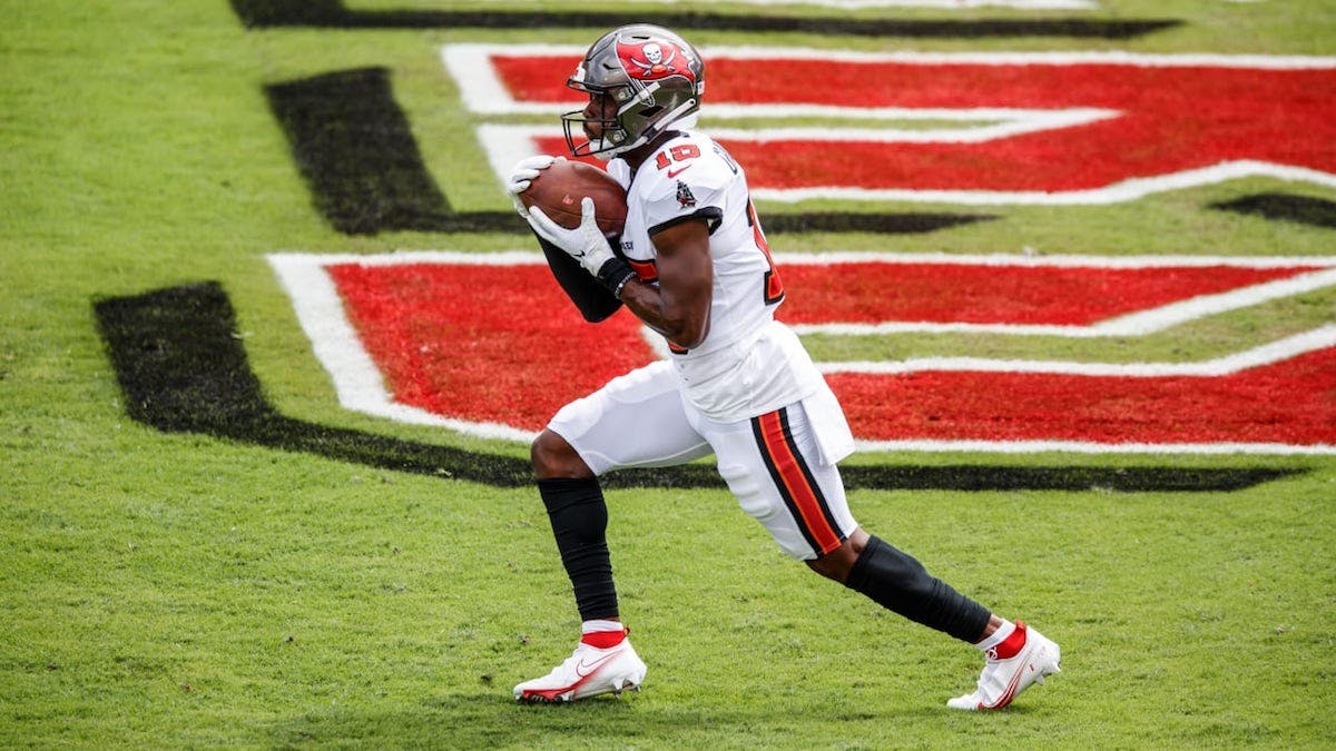 cyril grayson holding football