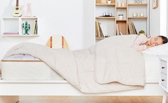 child sleeping in saatva youth mattress