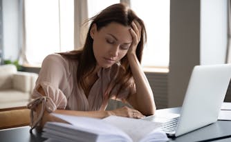 person with narcolepsy asleep at desk