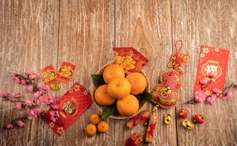oranges, red envelopes, and gold coins for chinese new year