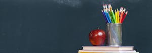saatva teachers discount - image of chalkboard, pencils, apple, and stack of books