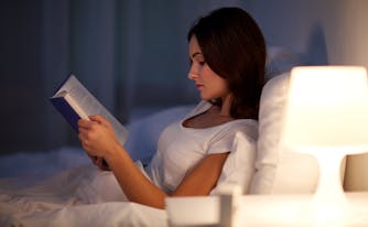 person reading in bed