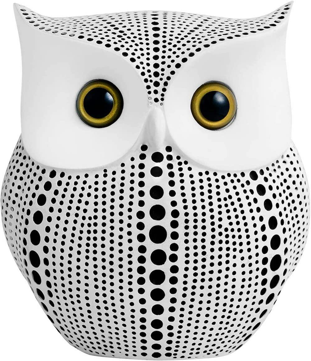 black and white spotted owl statue