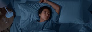 person sleeping in bed