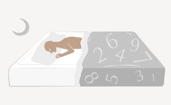 illustration of person lying in bed with enneagram numbers on comforter