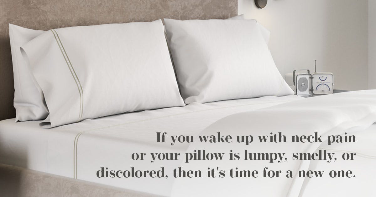 bed with pillows on top of it, stating when to toss your old pillow