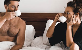 what your side of the bed says about you - image of couple in bed
