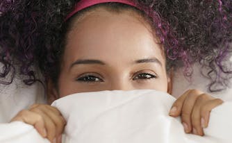 image of woman with sensitive skin under sheets