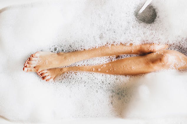 woman taking a warm bath