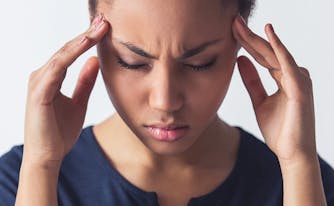 image of woman with exploding head syndrome sleep disorder