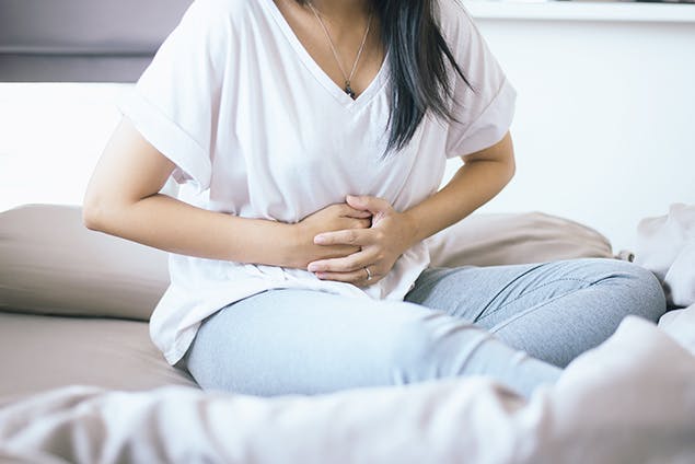 image of woman with period cramps