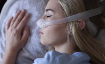 image of person wearing cpap machine for sleep apnea