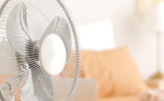 image of fan in hot bedroom