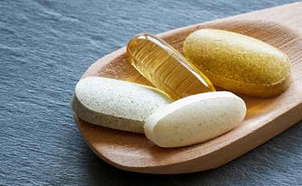 vitamin deficiency - image of spponful of vitamins
