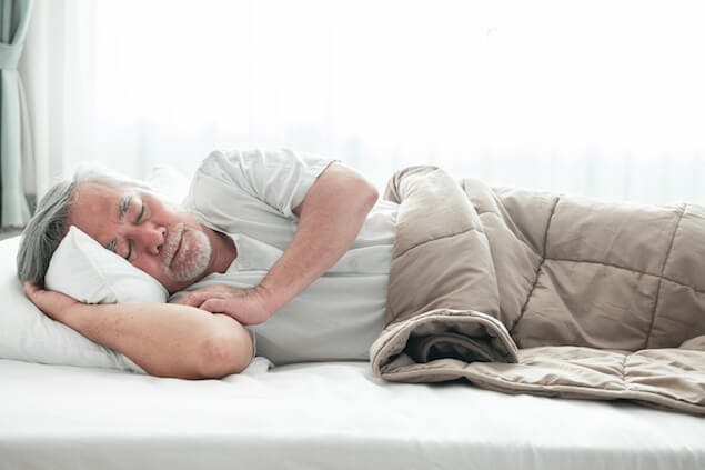 best mattress for elderly people - image of senior citizen in bed