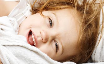 image of little girl in bed