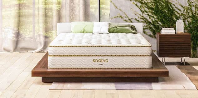 eco-friendly saatva mattress in bedroom with plants