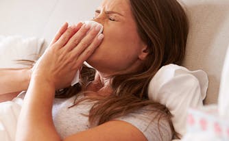 image of person with allergies sneezing