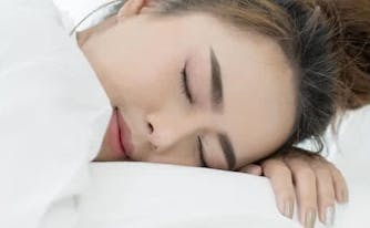 person sleeping in bed