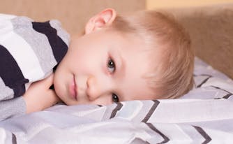 image of sleepy child in bed