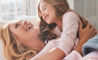 image of mother waking up child