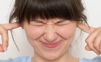 how to deal with snoring - image of woman with hands in ears