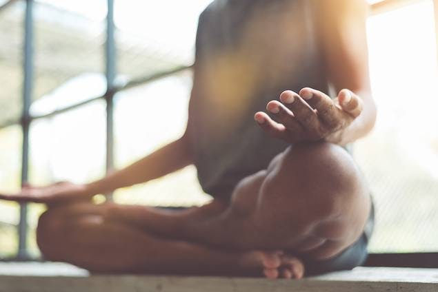 image of man meditating