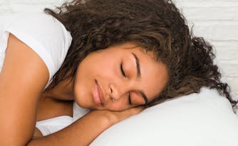 best combination sleeper pillow - image of person lying in bed