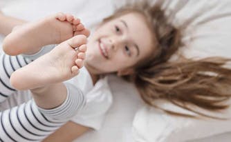 image of child with growing pains in bed