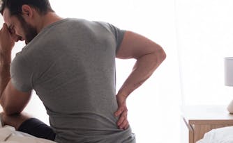 best mattress for back pain - image of person with back pain