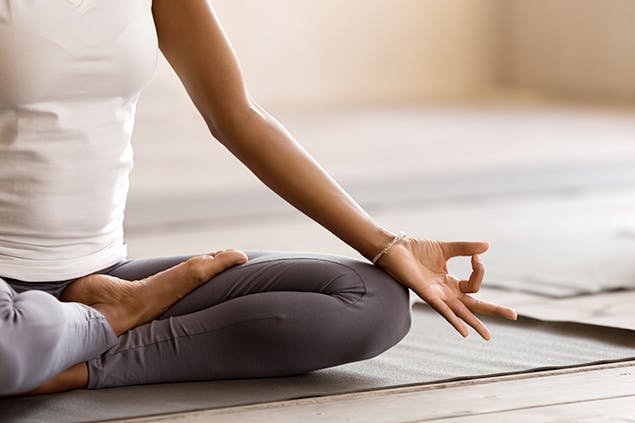 image of woman doing yoga stretch