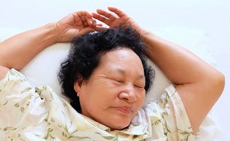 image of senior woman sleeping - sleep tips for older people
