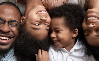 best mattress for lifestyle - image of family in bed