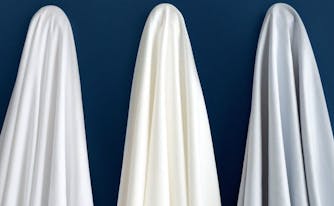 what does thread count mean - image of cotton sheets hanging up