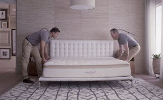 people delivering and setting up mattress after shopping