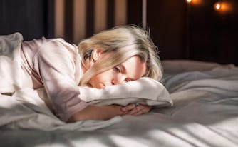 person lying in bed alone