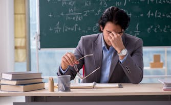 teacher tired at desk