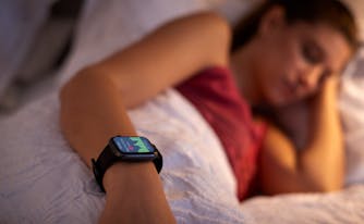 person with sleep tracker app on smartwatch