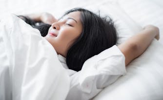 person asleep in bed