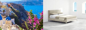 white buildings with blue domes on Santorini coastline, next to Saatva's Santorini platform bed frame