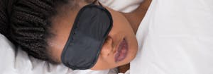 person wearing eye mask while sleeping