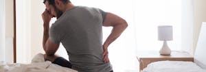 best mattress for back pain - image of person with back pain